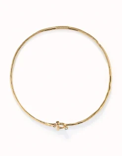 Collar rígido con cierre frontal bañado en oro 18k con topacio blanco