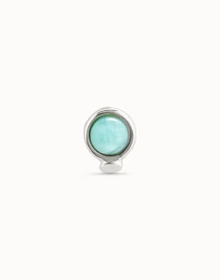 Piercing bañado en plata de ley y un cristal azul