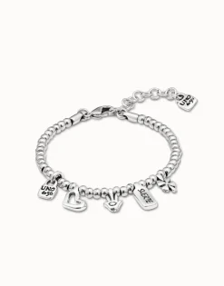 Pulsera bañada en plata de ley con charm corazón, trébol y mano