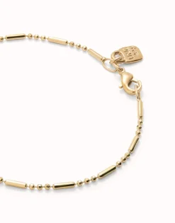 Pulsera con bolas y piezas alargadas bañada en oro 18k