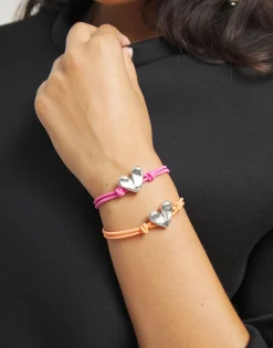 Pulsera de hilo elástico rosa con corazón bañado en plata de ley