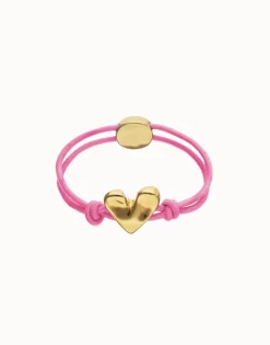 Pulsera de hilo elástico rosa con corazón bañado en oro 18k