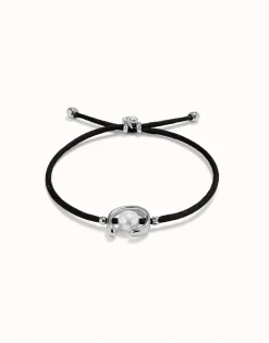 Pulsera de hilo negro con perla shell fornitura bañada en plata de ley.