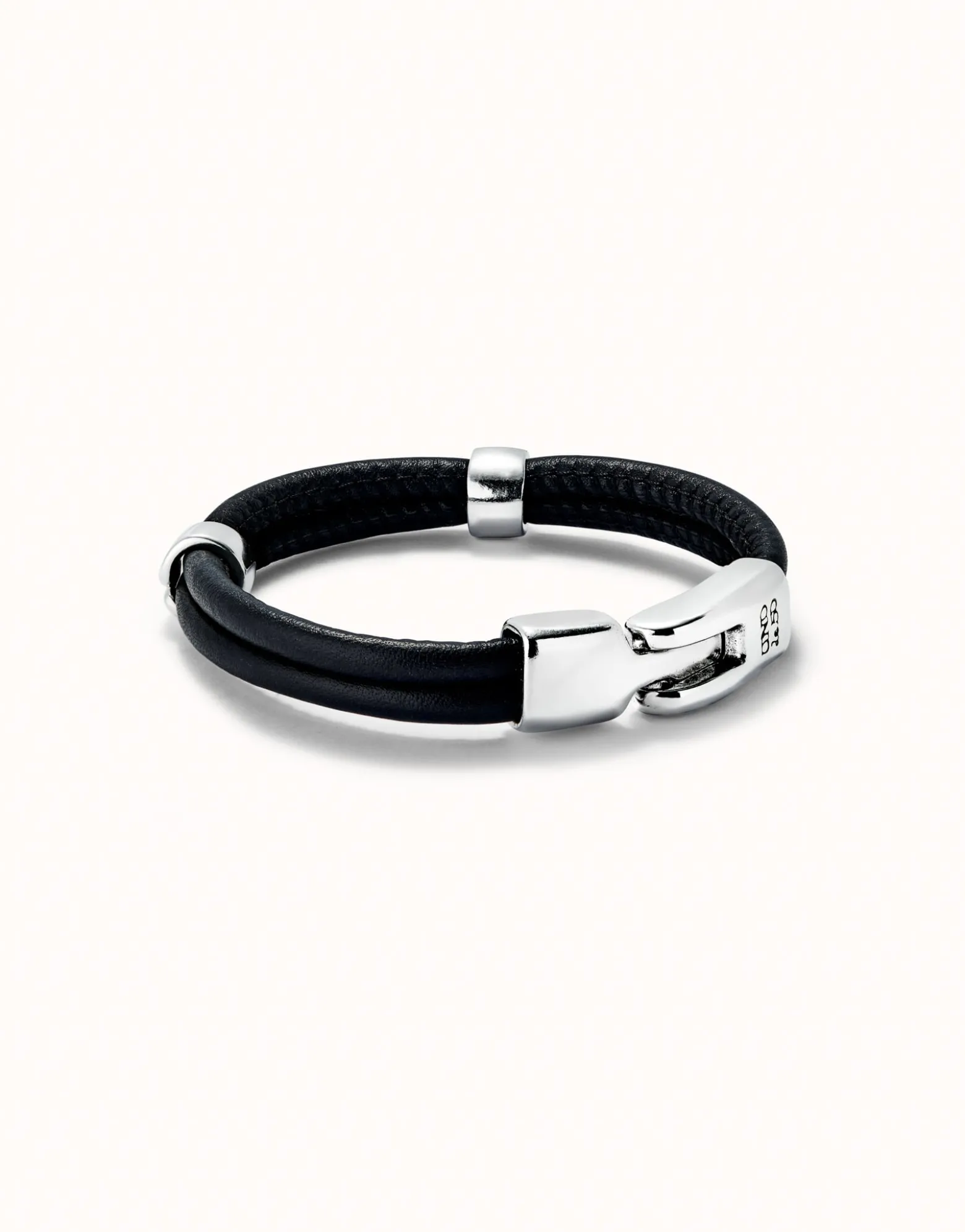Pulsera doble cuero con 2 circunferencias bañadas en plata de ley