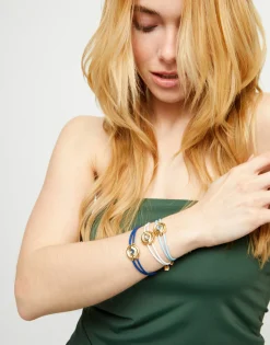 Pulsera doble de cuero azul con ojo bañado en oro 18k