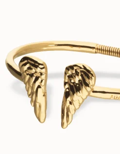 Pulsera rígida bañada en oro 18k con detalle de alas