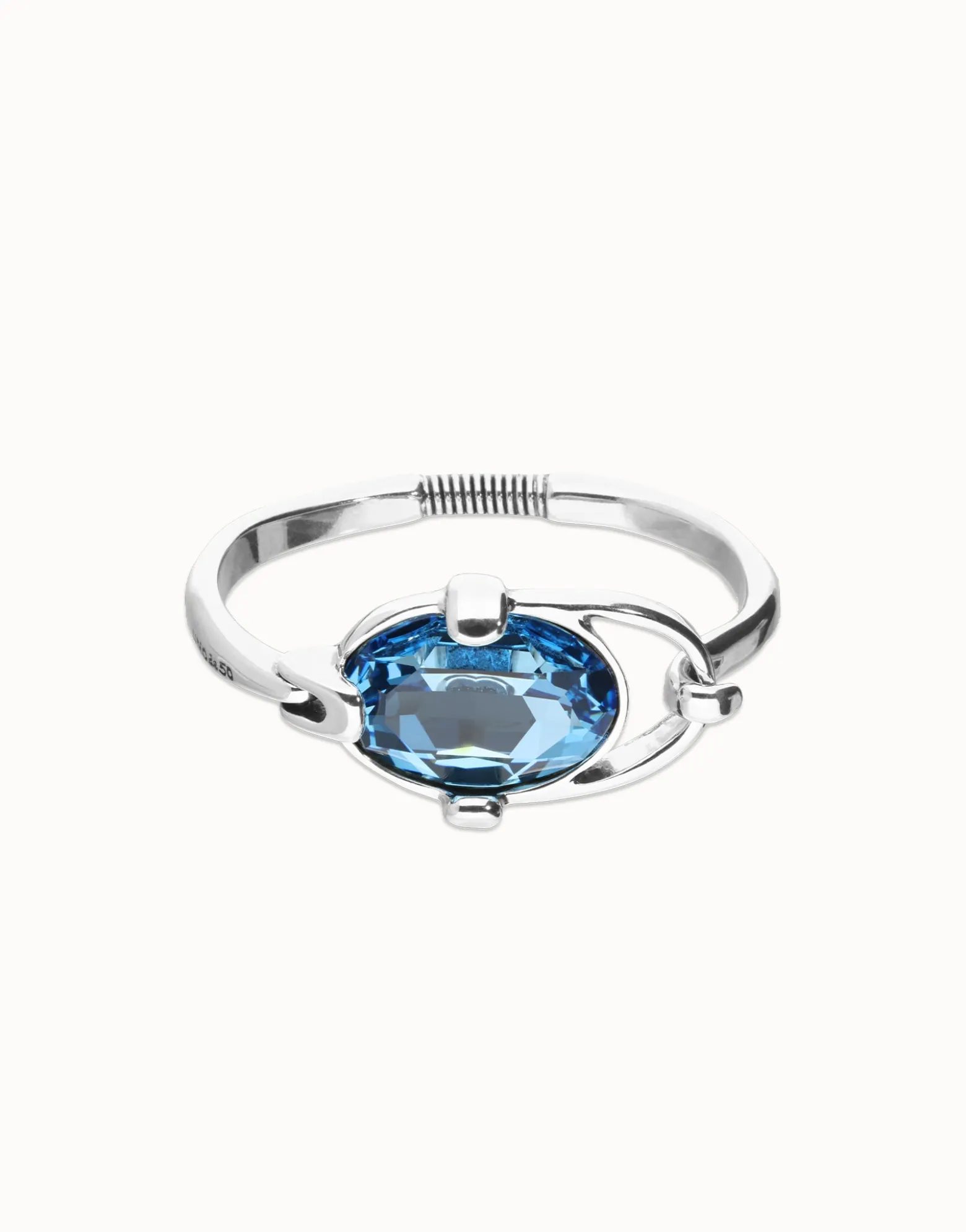 Pulsera rígida bañada en plata de ley con cristal facetado azul