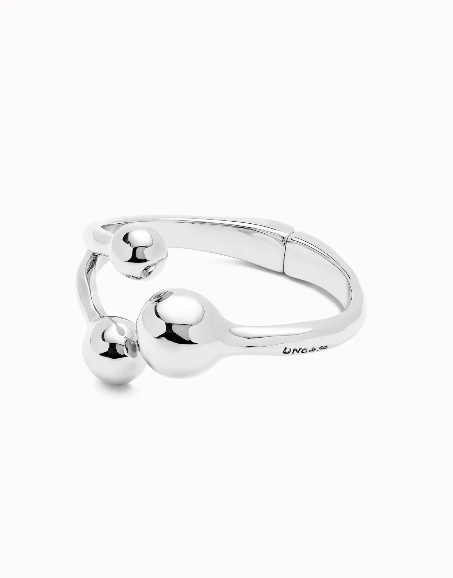 Pulsera rígida con tres bolas bañadas en plata de ley